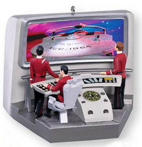 Admiral Kirk and Captain Spock watch from the bridge of the starship Enterprise as another ship approaches.