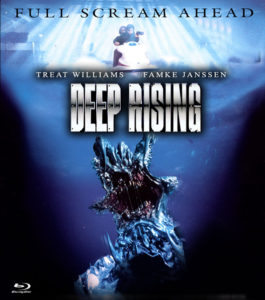 A monster rises from the depths of the ocean while two people on a jet ski zoom overhead.