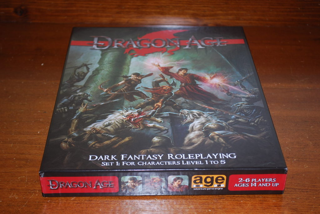The box for Dragon Age, Set 1 features several heroes fighting dark spawn monsters.