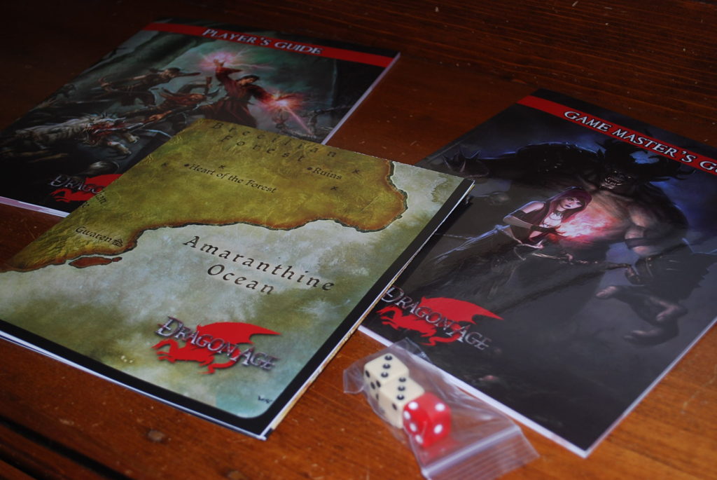 Two game booklets, a folded map, and a plastic bag containing two white six sided dice and one red die.