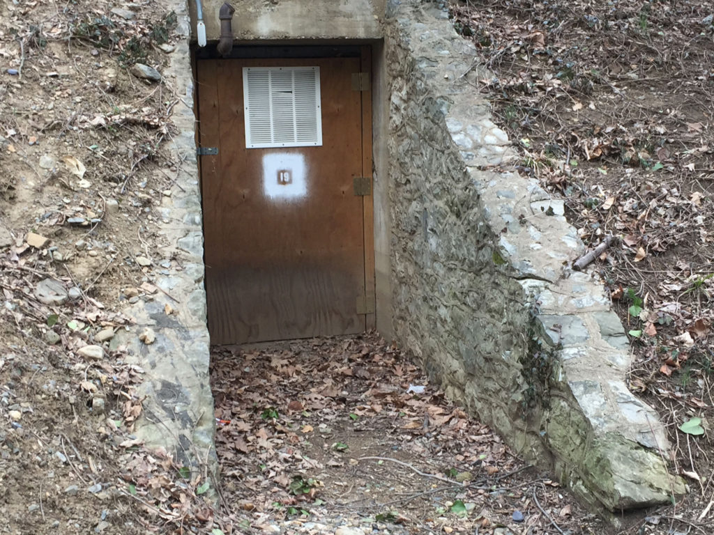 A door set amidst a stone wall.