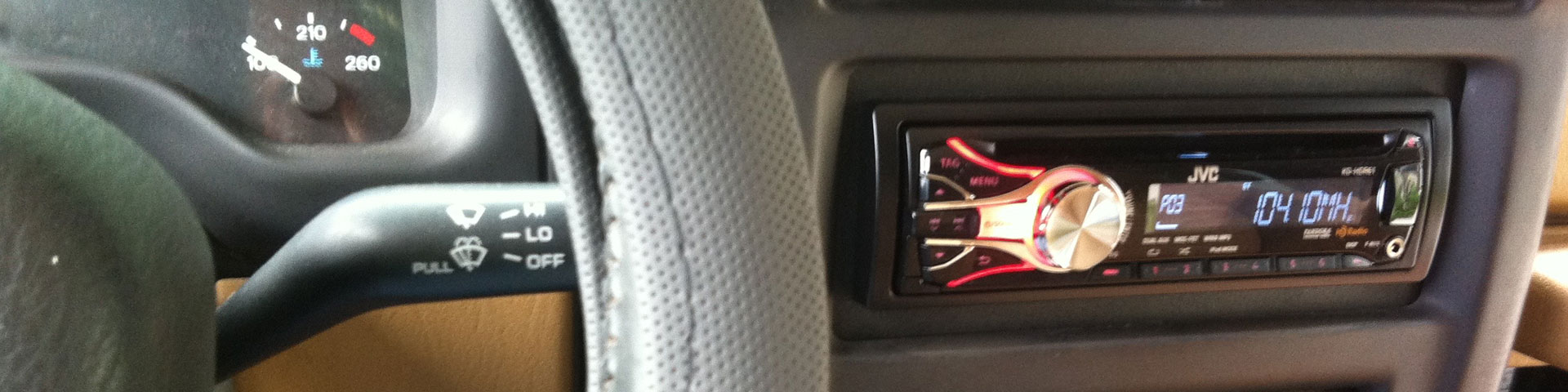 A close-up shot of the jeep's steering wheel and new digital radio.