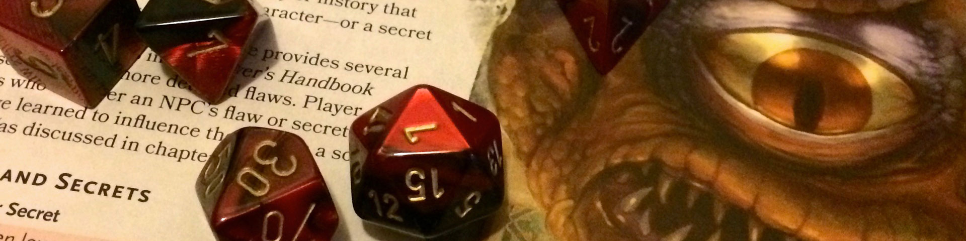 Red and black dice rest against a page of the Dungeon Master's Guide.