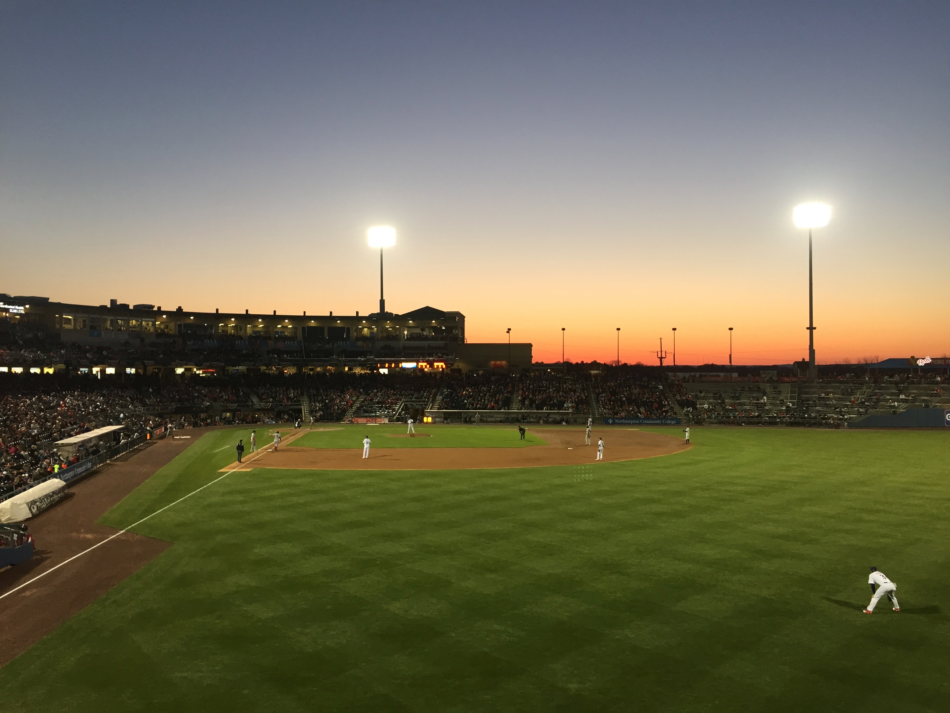 Sunset at an early spring IronPigs baseball game. The big AAA lights are lit up and the sky is just beginning to fade to black.
