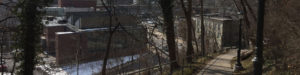 Bare trees and a concrete path overlook the city of Easton.