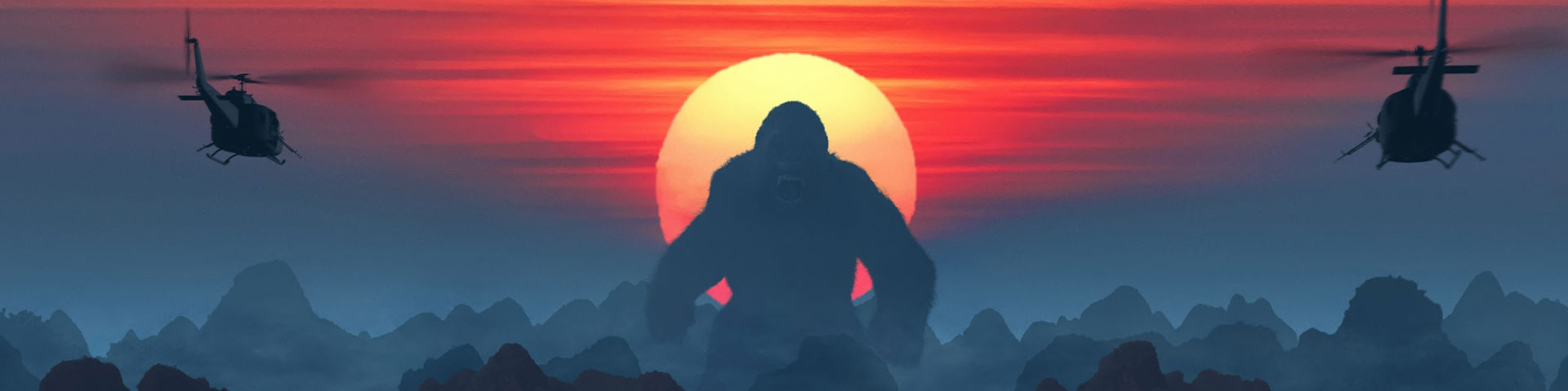 Helicopters fly toward a giant ape. The ape is backlit by a sunset; small mountains appear at his feet.