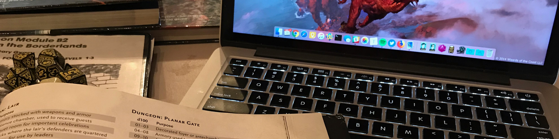 A laptop computer surrounded by role-playing game source books.