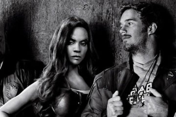 A black and white photo of the Guardians of the Galaxy standing against a wall.