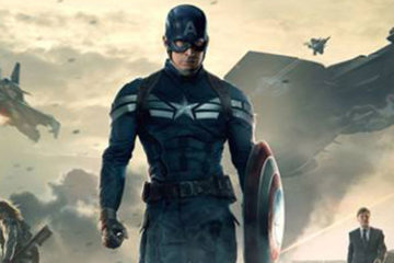 Captain America, in a dark blue uniform, is in the center of the photo while Nick Fury appears to the left and Black Widow to the right.
