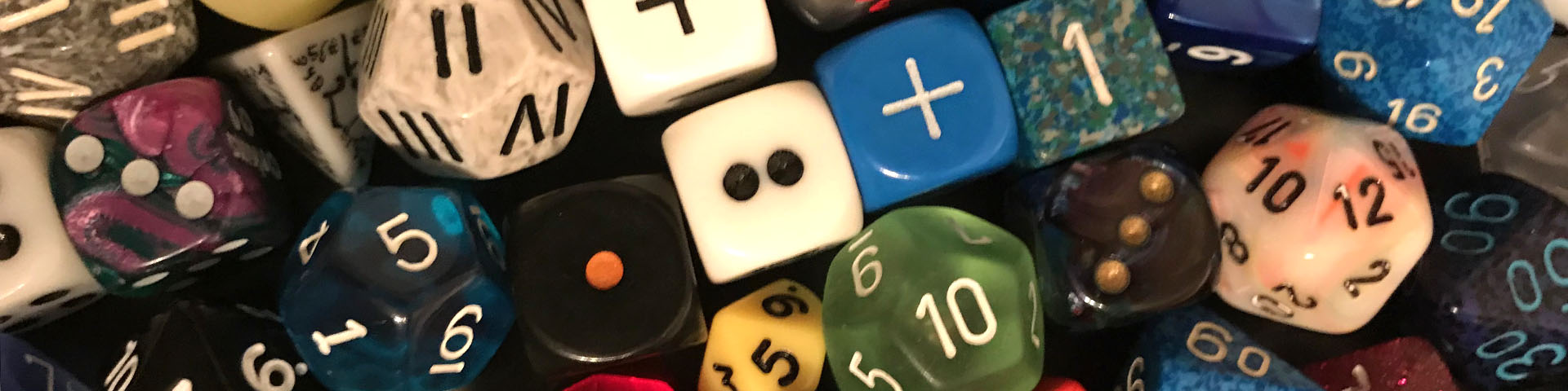 A collection of different sized and colored dice.