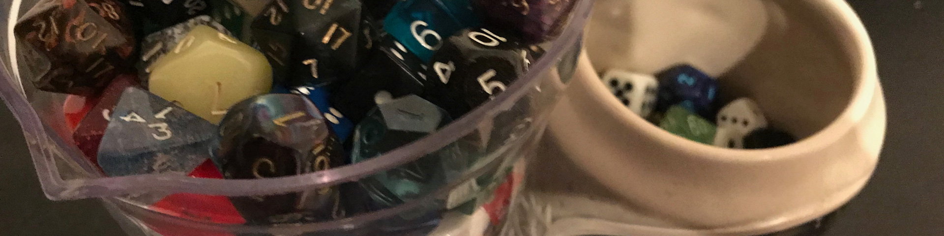 Two cups filled with dice.