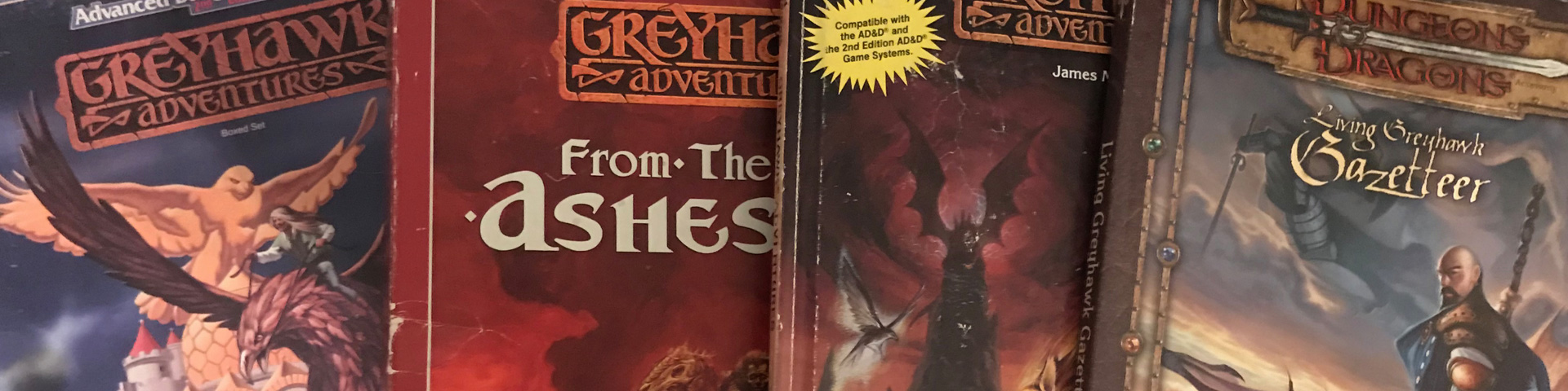 Two RPG boxed sets and two RPG books, all connected to the World of Greyhak campaign setting.