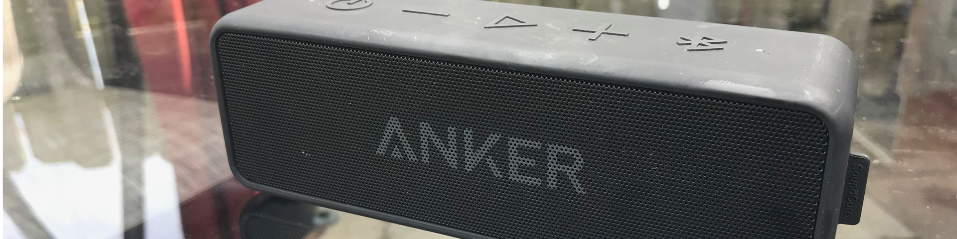 A close-up view of the black Anker speaker.