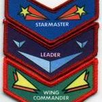 Three colorful chevrons labeled Starmaster, Leader, Wing Commander