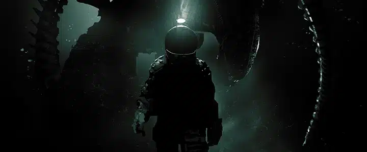 A space suited human with a head lamp pointed toward the viewer. An Alien appears ominously in the background.