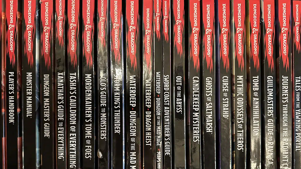 A spine view of a bunch of Dungeons and Dragons 5th Edition books ... which is not my favorite RPG of all time.