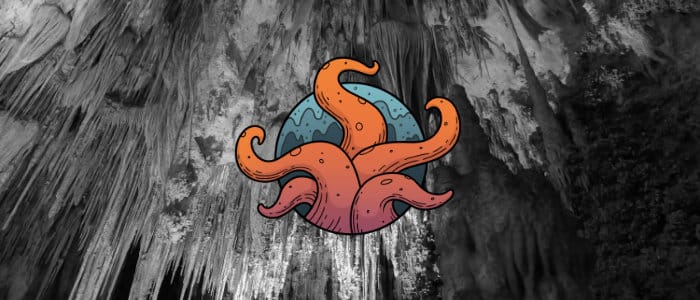 A logo featuring orange tentacles on a blue circular background appears over top a black and white cavern.
